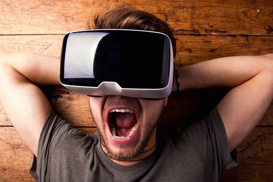 Amazed Man Laying and Enjoying VR